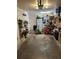 Cluttered garage interior featuring white walls, storage shelves, and a variety of household items at 641 N Garden Ave, Clearwater, FL 33755