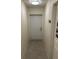 Narrow hallway with tile floors leading to an exterior door at 641 N Garden Ave, Clearwater, FL 33755