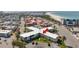 Overhead shot of condos near a sandy beach with turquoise waters at 7050 Sunset Way # 22, St Pete Beach, FL 33706