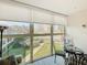 Bright enclosed balcony with outdoor seating, with nice views of the beach and ocean at 7050 Sunset Way # 22, St Pete Beach, FL 33706