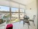 Enclosed balcony with outdoor seating, perfect for enjoying the views and natural light at 7050 Sunset Way # 22, St Pete Beach, FL 33706