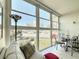 Bright enclosed balcony with outdoor seating, featuring lots of windows and natural light at 7050 Sunset Way # 22, St Pete Beach, FL 33706