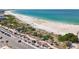 Picturesque beach view with palm trees, a walking path, and easy access to parking at 7050 Sunset Way # 22, St Pete Beach, FL 33706
