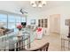 Living room with lots of seating and view of the kitchen at 7050 Sunset Way # 22, St Pete Beach, FL 33706