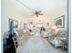 Spacious living area showcasing an open floor plan connecting the kitchen and seating areas at 7050 Sunset Way # 22, St Pete Beach, FL 33706