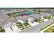 A high-angle view of a home in a lakeside community with lush landscaping and ample parking at 7405 Stonebrook Cir, Wesley Chapel, FL 33545