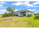 Spacious backyard with a covered patio and well-maintained landscaping at 7405 Stonebrook Cir, Wesley Chapel, FL 33545