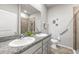 Bathroom with double sink vanity and walk-in shower with glass door at 7405 Stonebrook Cir, Wesley Chapel, FL 33545