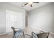 Spacious bedroom with a double door closet and two chairs with a table between them at 7405 Stonebrook Cir, Wesley Chapel, FL 33545
