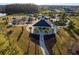 Aerial view of community park featuring pavilion, landscaping, and a walkway, nestled in a well-maintained residential area at 7405 Stonebrook Cir, Wesley Chapel, FL 33545