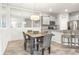 Dining room featuring tile floors and modern lighting at 7405 Stonebrook Cir, Wesley Chapel, FL 33545