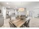 Dining room, kitchen and adjacent rooms with great natural light at 7405 Stonebrook Cir, Wesley Chapel, FL 33545