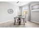 A bright office with a large window, modern desk, and ample natural light for working at home at 7405 Stonebrook Cir, Wesley Chapel, FL 33545