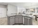 Kitchen island with stainless steel dishwasher and sink at 7405 Stonebrook Cir, Wesley Chapel, FL 33545