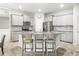 Bright kitchen with granite countertops, stainless steel appliances, and gray cabinets at 7405 Stonebrook Cir, Wesley Chapel, FL 33545