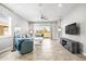 Bright living room with tile flooring, comfortable seating, and sliding glass doors for natural light at 7405 Stonebrook Cir, Wesley Chapel, FL 33545