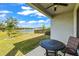 Covered outdoor patio with a pond view at 7405 Stonebrook Cir, Wesley Chapel, FL 33545