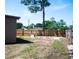 Backyard featuring a wood fence and green grass at 771 Murphy N Ave, St Petersburg, FL 33703