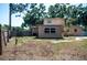 Backyard featuring a wood fence, green grass, and a partial view of the home at 771 Murphy N Ave, St Petersburg, FL 33703