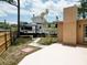 Backyard featuring a recreational vehicle (RV) parked near home with landscaping at 771 Murphy N Ave, St Petersburg, FL 33703