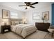 Minimalist bedroom with neutral tones, two windows, and soft ambient lighting at 771 Murphy N Ave, St Petersburg, FL 33703