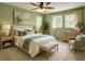 Serene bedroom with ample natural light and tranquil green color scheme at 771 Murphy N Ave, St Petersburg, FL 33703