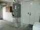 Well-organized garage showing the utility installations and additional storage cabinets offering practicality at 771 Murphy N Ave, St Petersburg, FL 33703