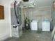 Functional garage area equipped with a washer, dryer, and water heater enhancing the home's utility at 771 Murphy N Ave, St Petersburg, FL 33703