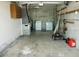 Spacious garage featuring laundry area, lawn care equipment and ample storage space for a functional utility area at 771 Murphy N Ave, St Petersburg, FL 33703