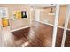 Open living space featuring laminate wood flooring with view to kitchen at 771 Murphy N Ave, St Petersburg, FL 33703
