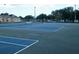 Outdoor tennis courts with blue and green surface and white lines, located in front of single-story building at 771 Murphy N Ave, St Petersburg, FL 33703