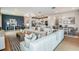 Spacious living room seamlessly flows from the kitchen, offering a comfortable seating area and stylish decor at 9950 Trellis Vine Way, Parrish, FL 34219