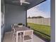 Relaxing screened-in patio with comfortable seating, perfect for enjoying outdoor living at 9950 Trellis Vine Way, Parrish, FL 34219