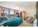 Bedroom with water view, ceiling fan, and closet with mirror doors at 1 Key Capri # 608E, Treasure Island, FL 33706