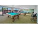 Billiards and other recreational games available to residents with large bright windows and comfortable seating at 1 Key Capri # 608E, Treasure Island, FL 33706