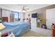 Main bedroom with carpet, fan, balcony view and multiple furniture pieces at 1 Key Capri # 608E, Treasure Island, FL 33706