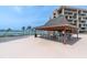 Waterfront patio with ample seating perfect for outdoor entertaining and enjoying the view at 1 Key Capri # 608E, Treasure Island, FL 33706