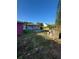 The backyard features a small patio, mature landscaping, and plenty of space for outdoor activities at 1013 E Lake Ave, Tampa, FL 33605