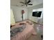 Bright bedroom with a large window, tile flooring, and ample closet space at 1013 E Lake Ave, Tampa, FL 33605