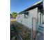 Exterior view of a single-story home with a fenced yard and street access at 1013 E Lake Ave, Tampa, FL 33605