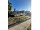 Charming single-story home featuring a cozy front porch and a well-lit exterior at 1013 E Lake Ave, Tampa, FL 33605