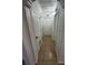 Hallway with multiple doors, neutral paint, and tile floors at 1013 E Lake Ave, Tampa, FL 33605