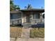 Inviting front porch with white railings and decorative columns, perfect for relaxing at 1013 E Lake Ave, Tampa, FL 33605