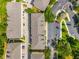 Aerial view showcases the community layout, parking, landscaping and building design at 10144 Arbor Run Dr # 139, Tampa, FL 33647
