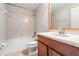 Clean and functional bathroom with a tub-shower combo, tiled walls, and a classic vanity at 10144 Arbor Run Dr # 139, Tampa, FL 33647