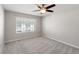 Bright bedroom featuring a ceiling fan and natural light, creating a relaxing atmosphere at 10144 Arbor Run Dr # 139, Tampa, FL 33647