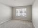 Serene bedroom with neutral carpet, ample natural light, and a minimalist design at 10144 Arbor Run Dr # 139, Tampa, FL 33647