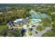 Aerial shot of the resort-style community featuring a pool, tennis courts, clubhouse, and lush landscaping at 10144 Arbor Run Dr # 139, Tampa, FL 33647