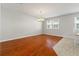 Dining area with hardwood floors and a chandelier, filled with natural light at 10144 Arbor Run Dr # 139, Tampa, FL 33647