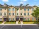 Attractive exterior of the multi-Gathering home with parking, manicured landscaping, and decorative doors at 10144 Arbor Run Dr # 139, Tampa, FL 33647